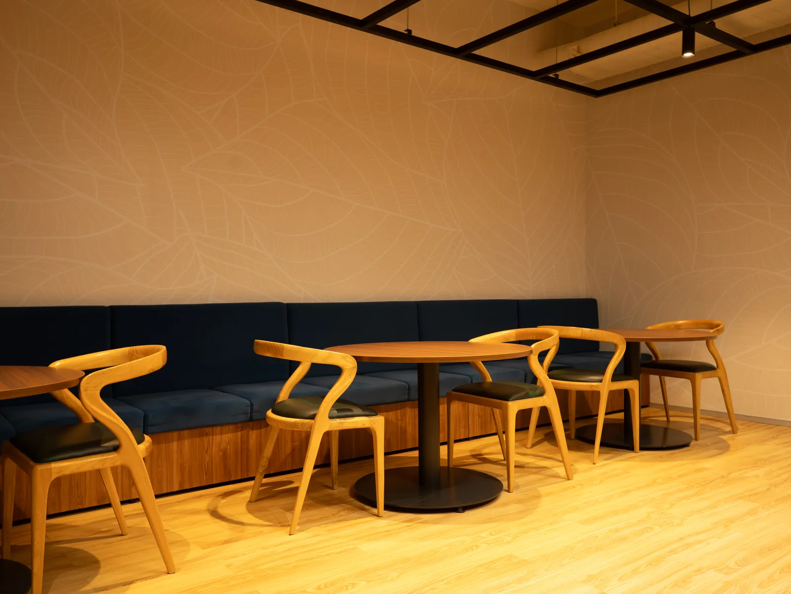 Café seating with timber chairs and navy banquette — Moschip